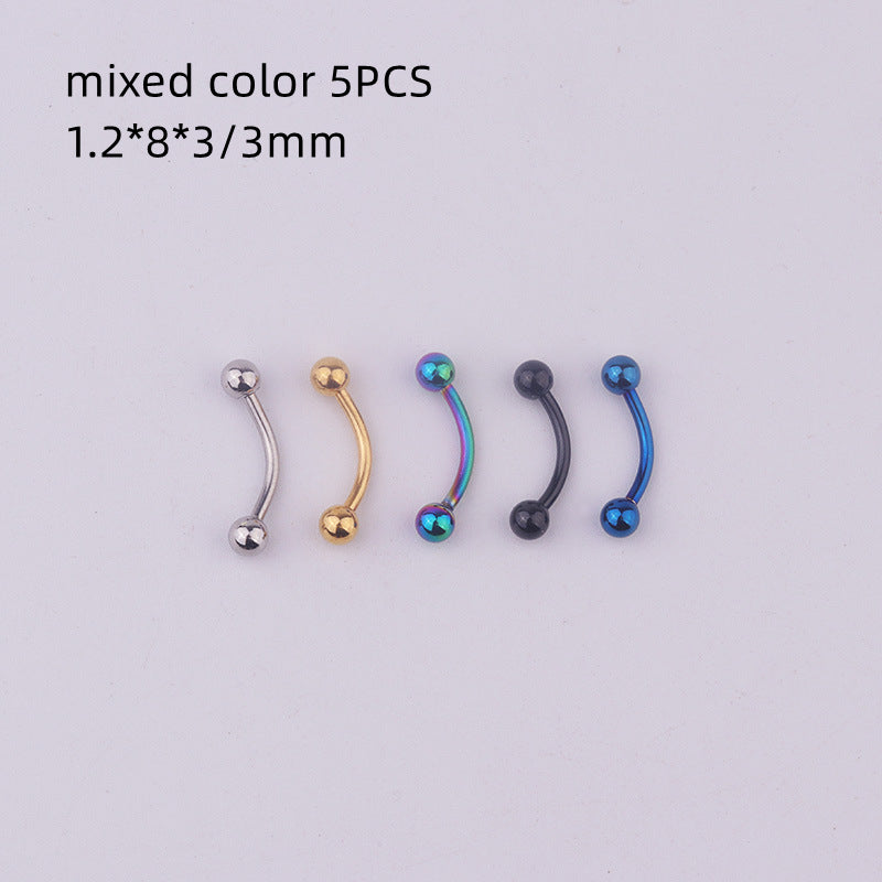 a set of four different colored nose piercings