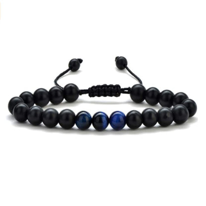 a black and blue beaded bracelet on a white background