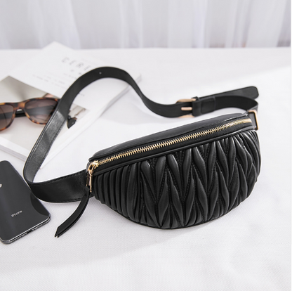 a black purse with a phone and sunglasses
