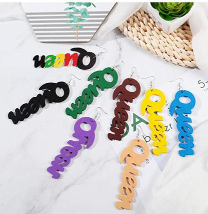 a bunch of colorful wooden letters hanging on a wall