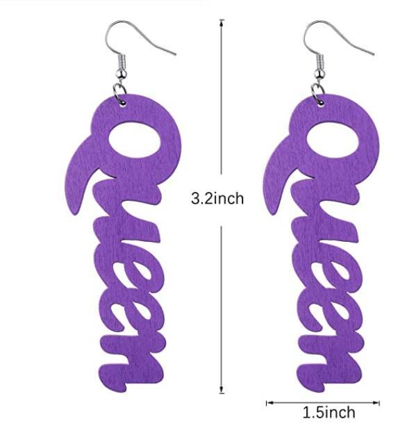 a pair of purple wooden earrings with the word go