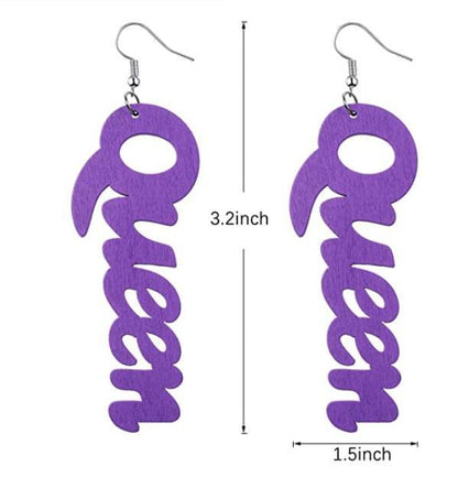 a pair of purple wooden earrings with the word go