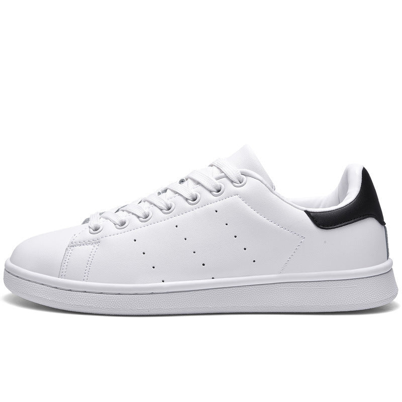 a white and black tennis shoe on a white background
