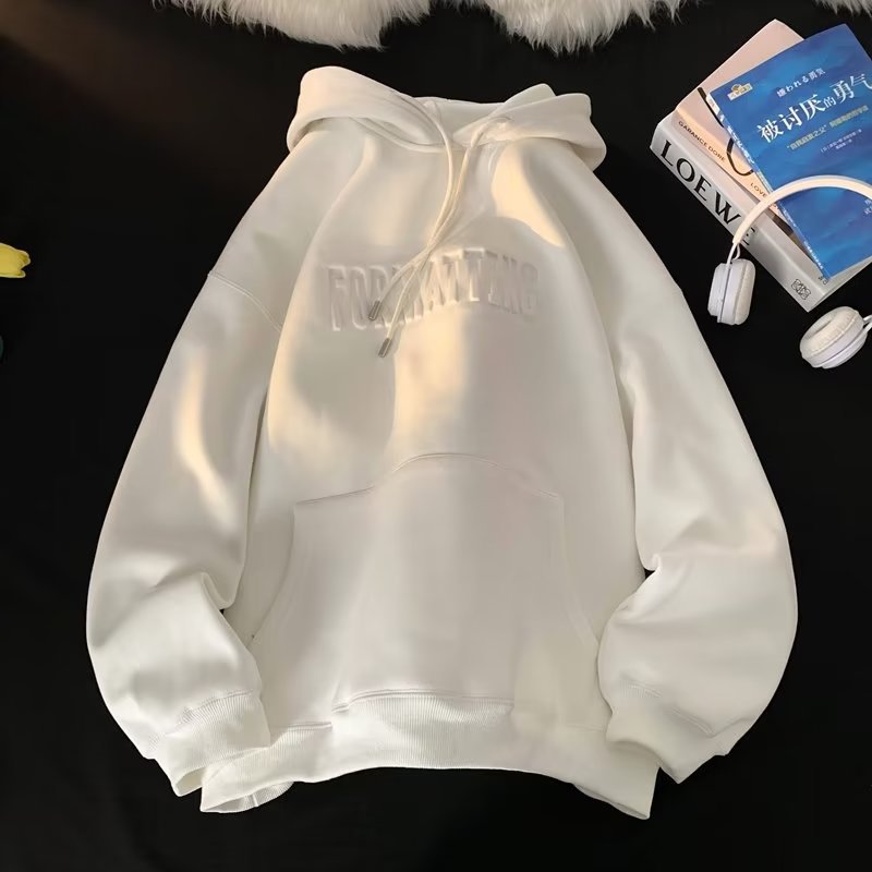 a white sweatshirt with a book and headphones