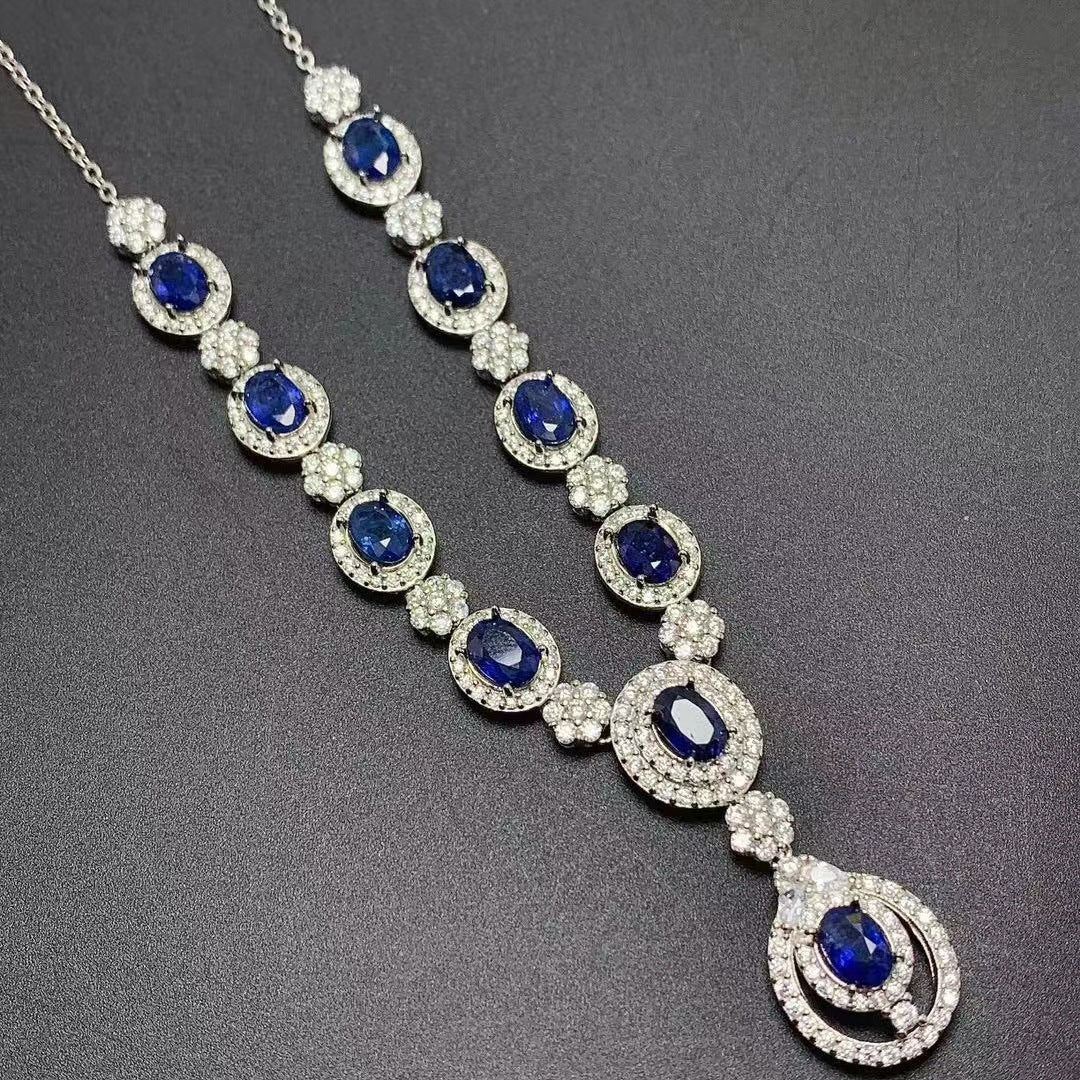 a necklace with blue and white stones on it
