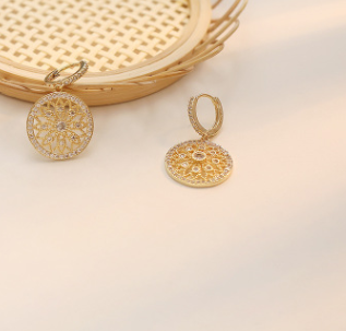 a close up of a basket and a pair of earrings