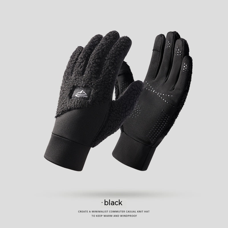 a pair of black gloves sitting on top of each other