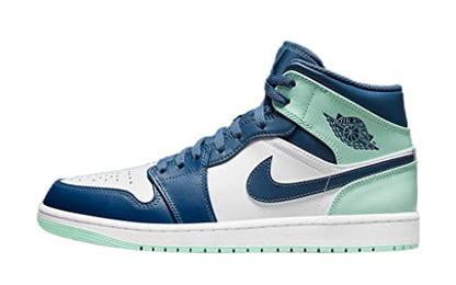 a pair of sneakers with blue and green accents