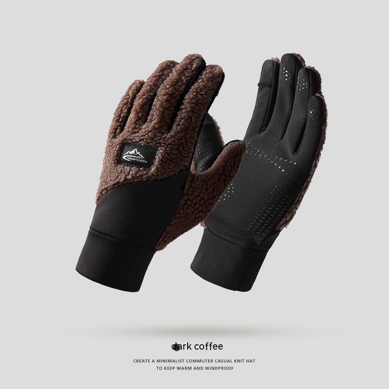 a pair of black gloves with a brown glove on top of it