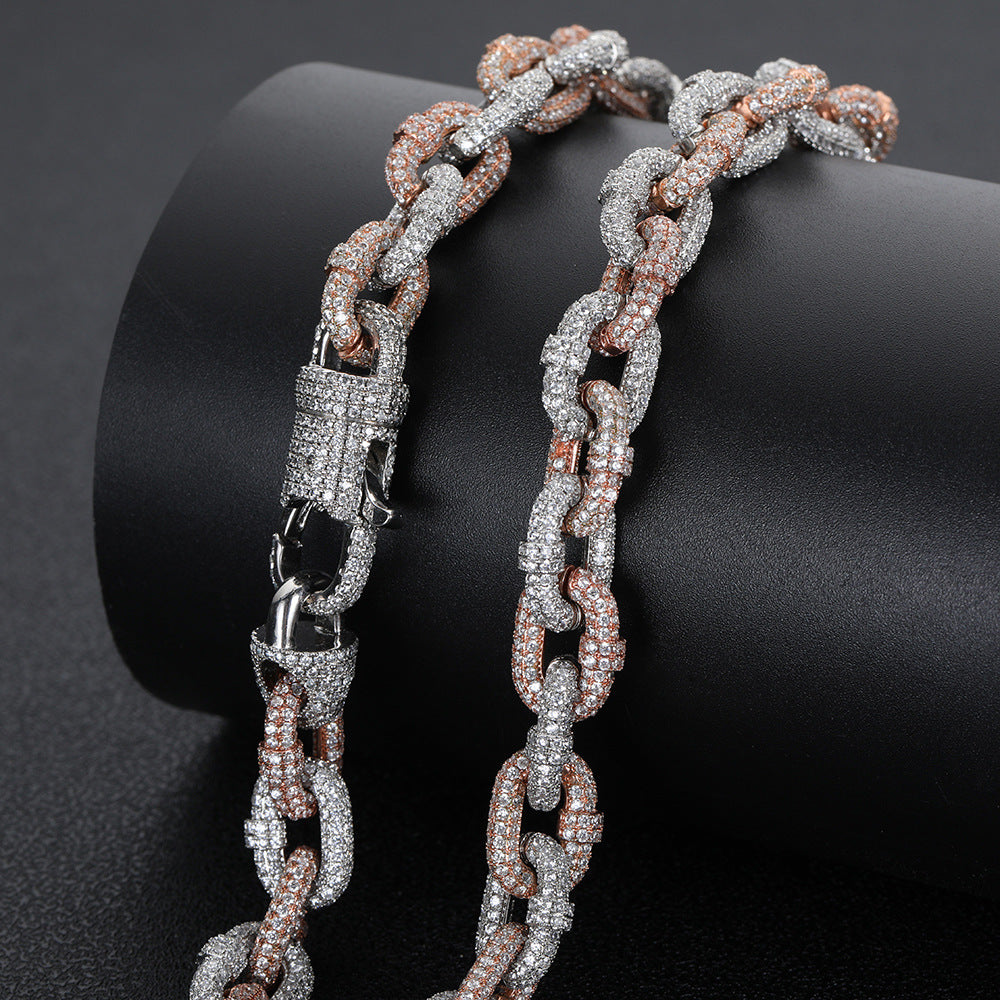 a silver and brown bracelet with a black diamond clasp