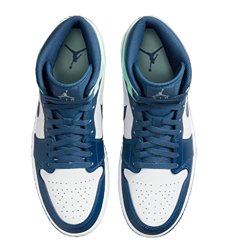 a pair of blue and white sneakers on a white background