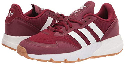 a red and white adidas sneakers on a white background