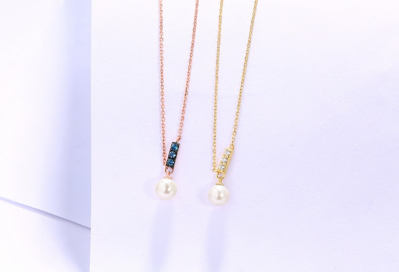 two necklaces with pearls on a white background