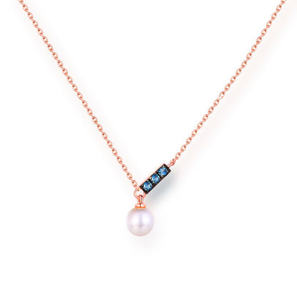 a necklace with a pearl and blue stones