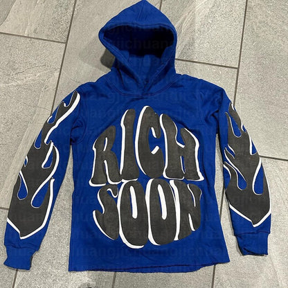 a blue hoodie with black and white writing on it