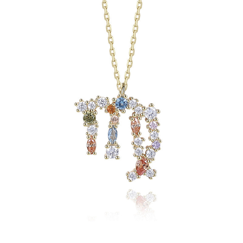 a necklace with the word mom written in multicolored stones