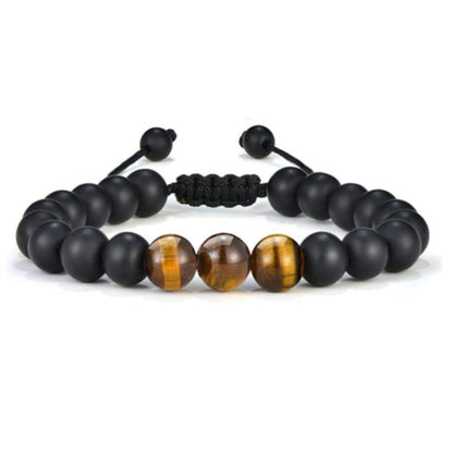 a bracelet with tiger eye beads and black cord