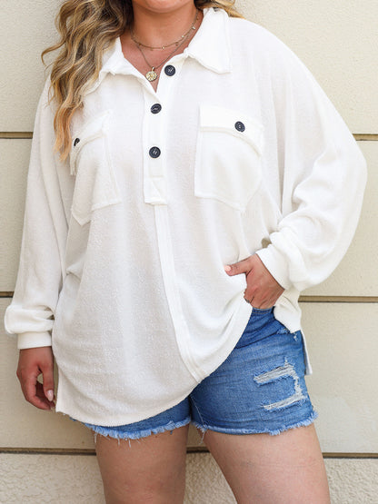 a woman wearing a white shirt and denim shorts