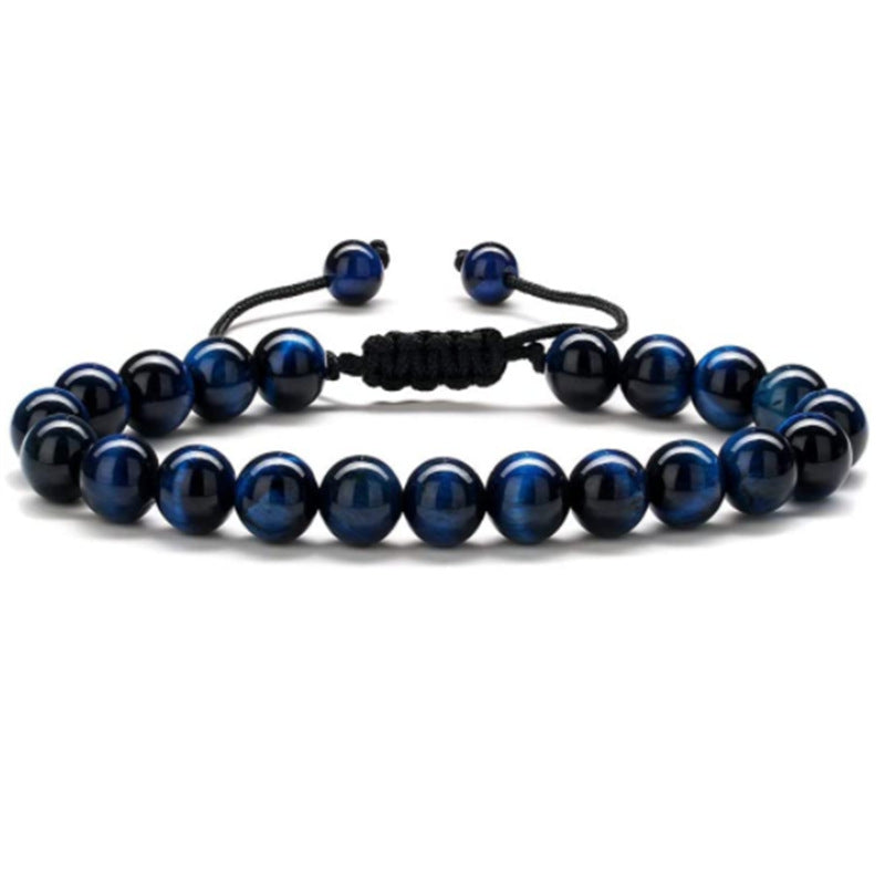 a blue bracelet with black beads on a white background
