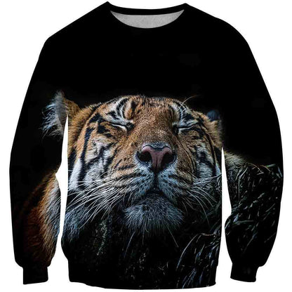 a close up of a tiger's face on a black sweater