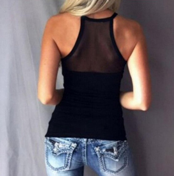 a woman wearing jeans and a black tank top