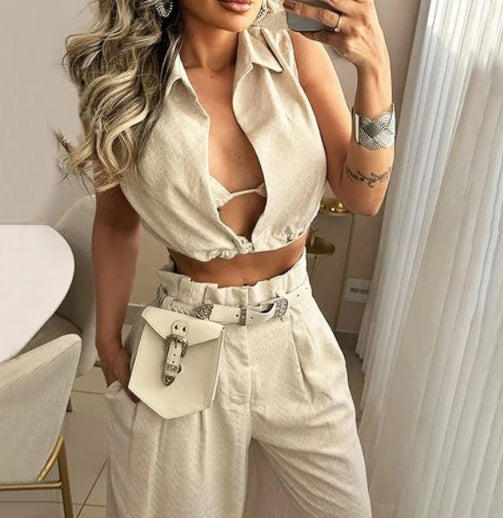 a woman taking a selfie in a white outfit