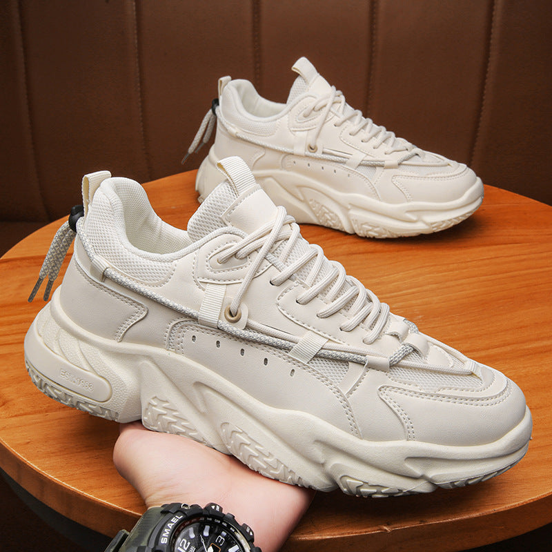 a pair of white sneakers sitting on top of a wooden table