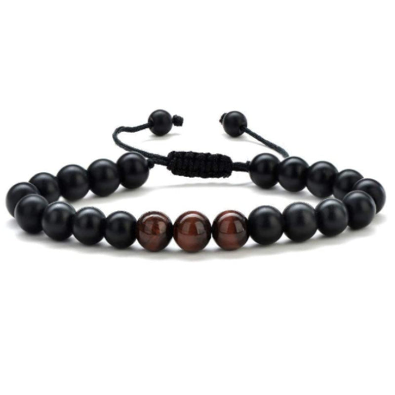 a black and brown beaded bracelet on a white background