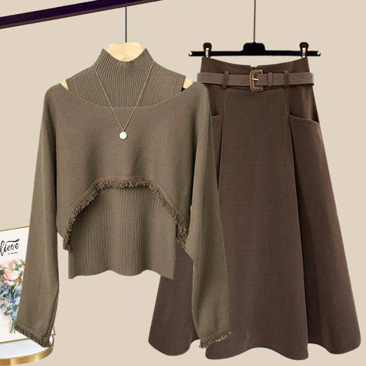 a brown sweater and a brown skirt on a hanger