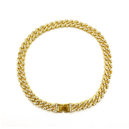 a gold chain with a clasp on a white background