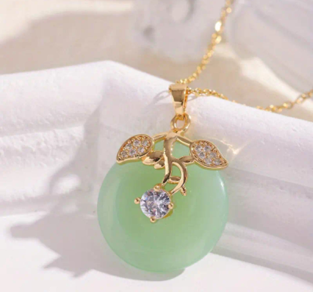 JADE CHARM ON GOLDEN NECKLACE