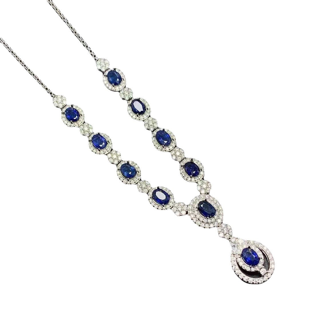 a necklace with blue stones and diamonds