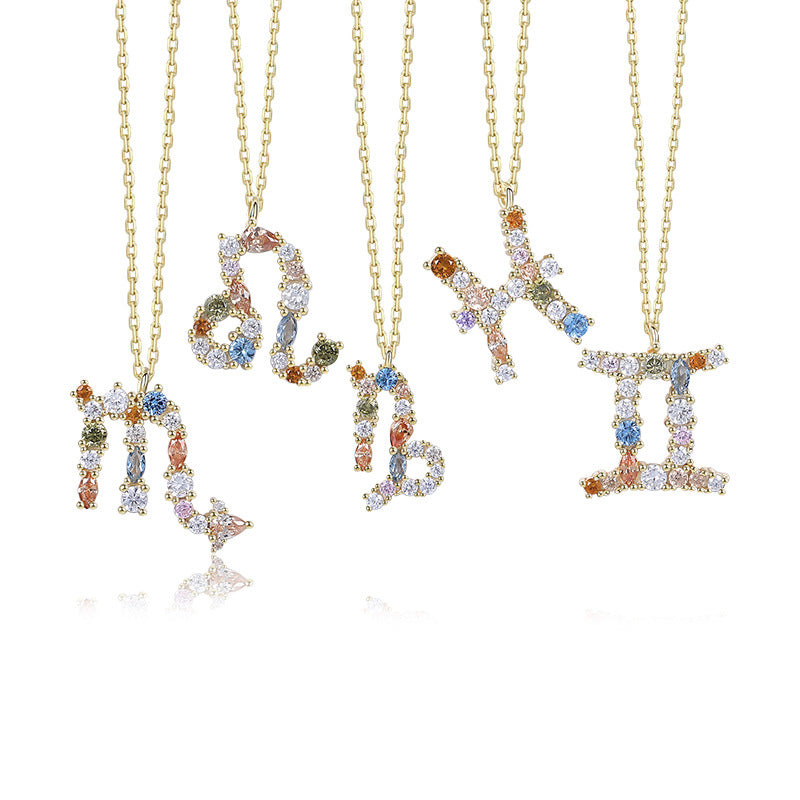 a group of three necklaces with letters on them