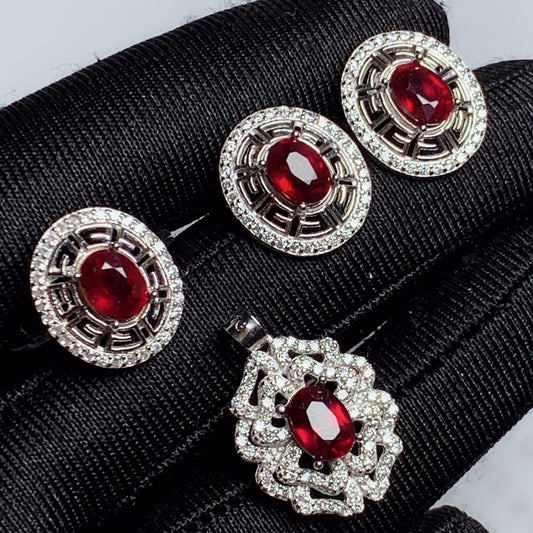 three pairs of red and white diamond earrings
