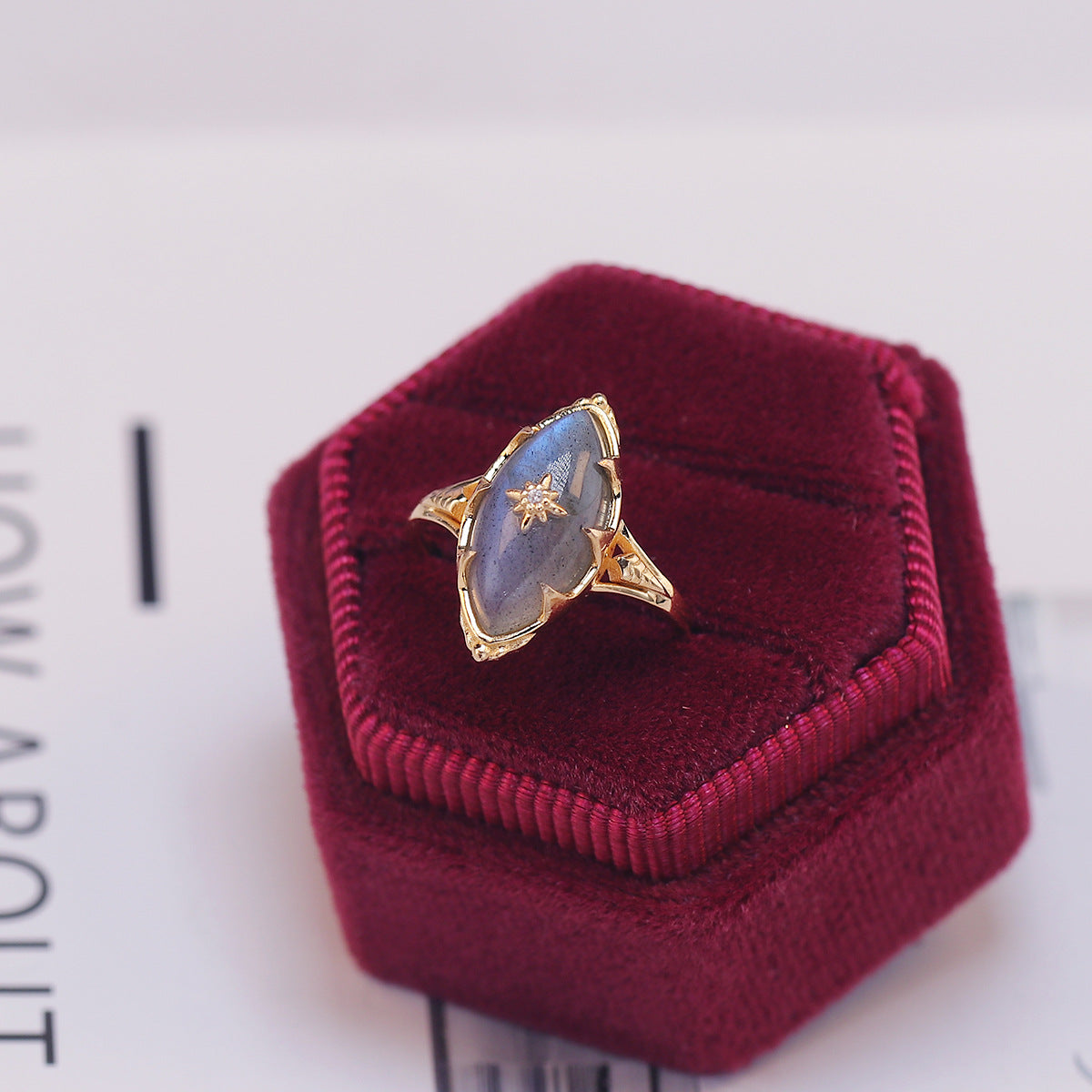 a gold ring with a blue stone in it