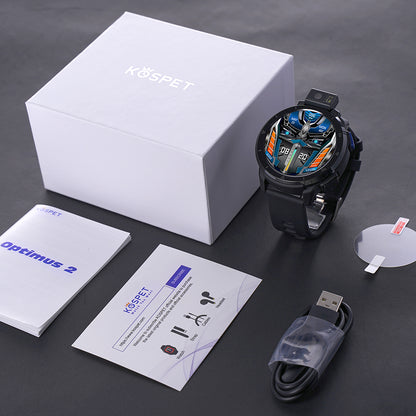 a watch sitting on top of a table next to a box