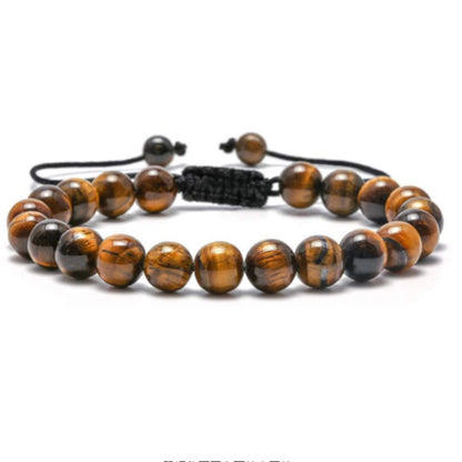 a tiger's eye beaded bracelet with a black cord