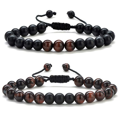 a couple of bracelets with beads on a white background