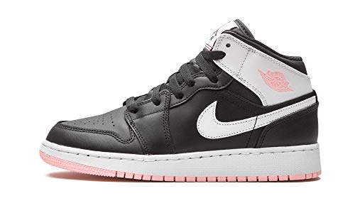 a pair of black and white shoes with pink soles