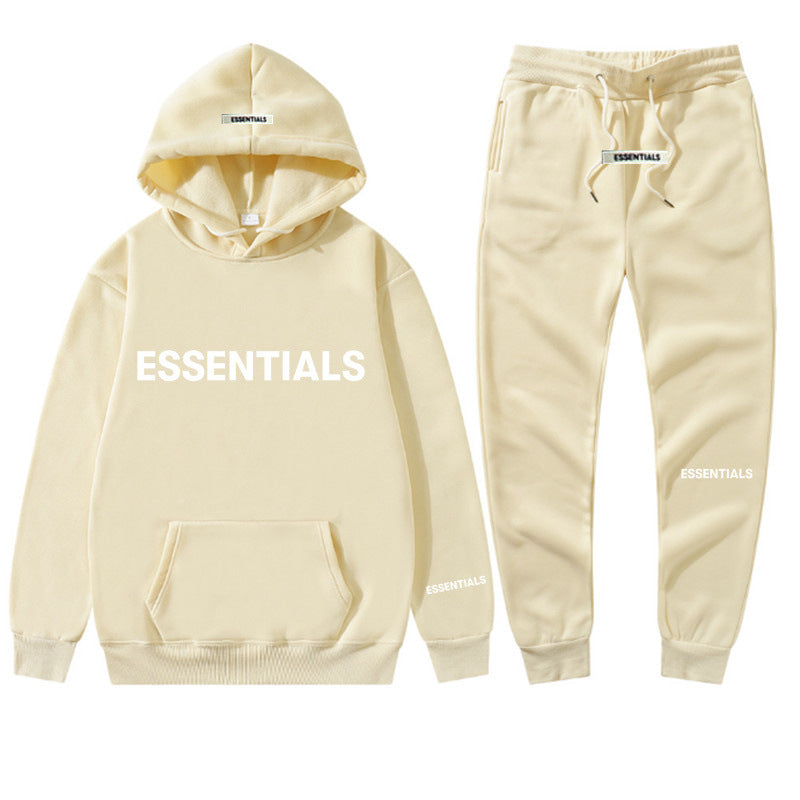 a white hoodie and sweatpants with the words essentials printed on it