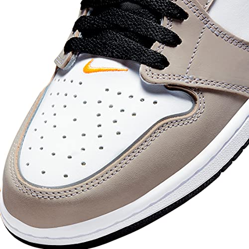 a pair of sneakers with a white and orange shoelace