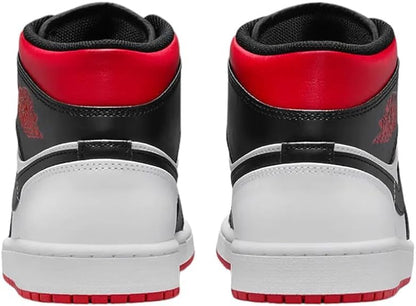 a pair of sneakers with red and black soles