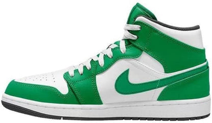 a pair of green and white sneakers