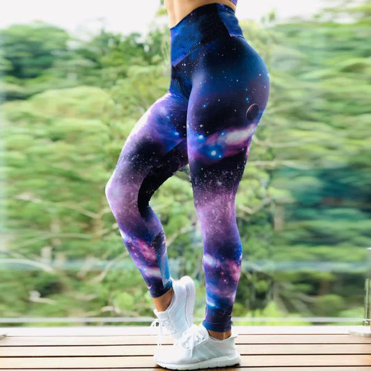 a woman in blue and purple galaxy print leggings