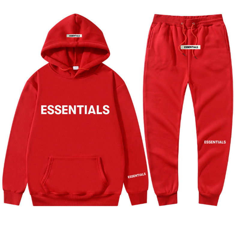 a red sweat suit with the words essentials printed on it