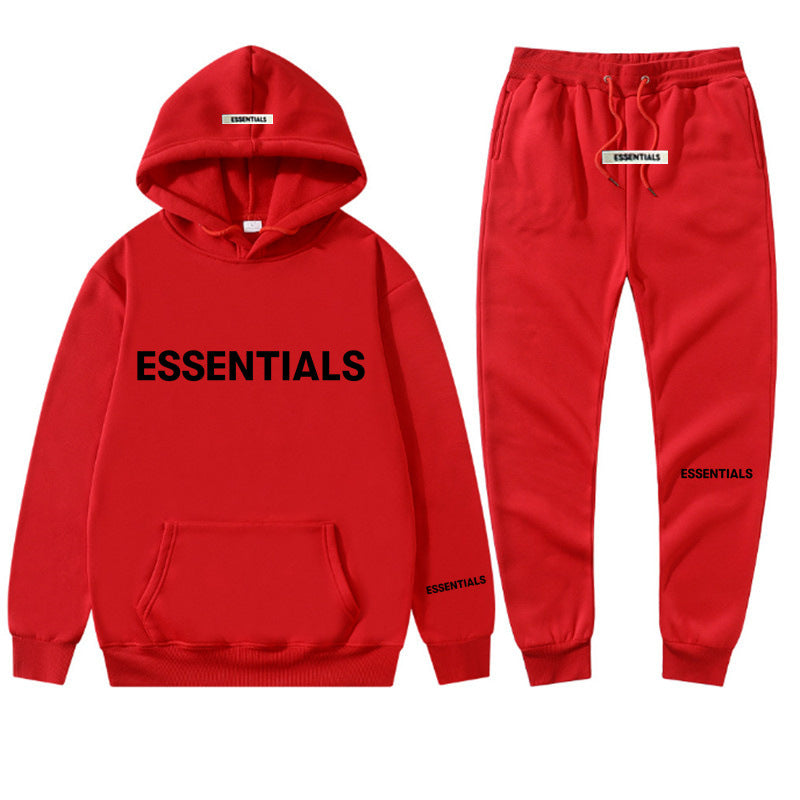 a red sweat suit with the words essentials printed on it