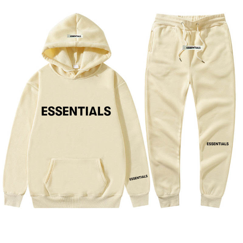 a white hoodie and sweatpants with the words essentials printed on it